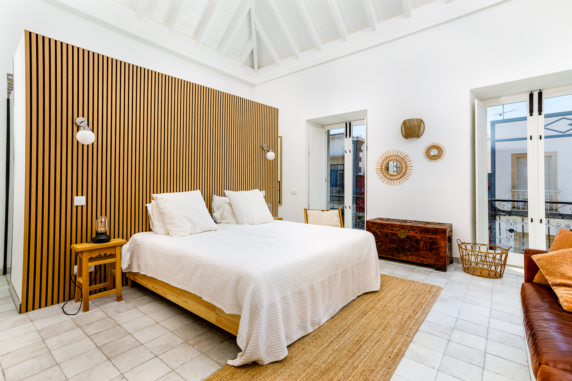 Luxury villa interior — open-plan living space with natural light and studio flash blend